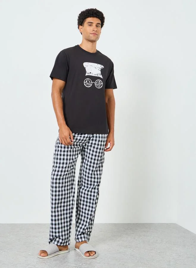 Styli Men Graphic Print T-Shirt and Checked Pyjama Set