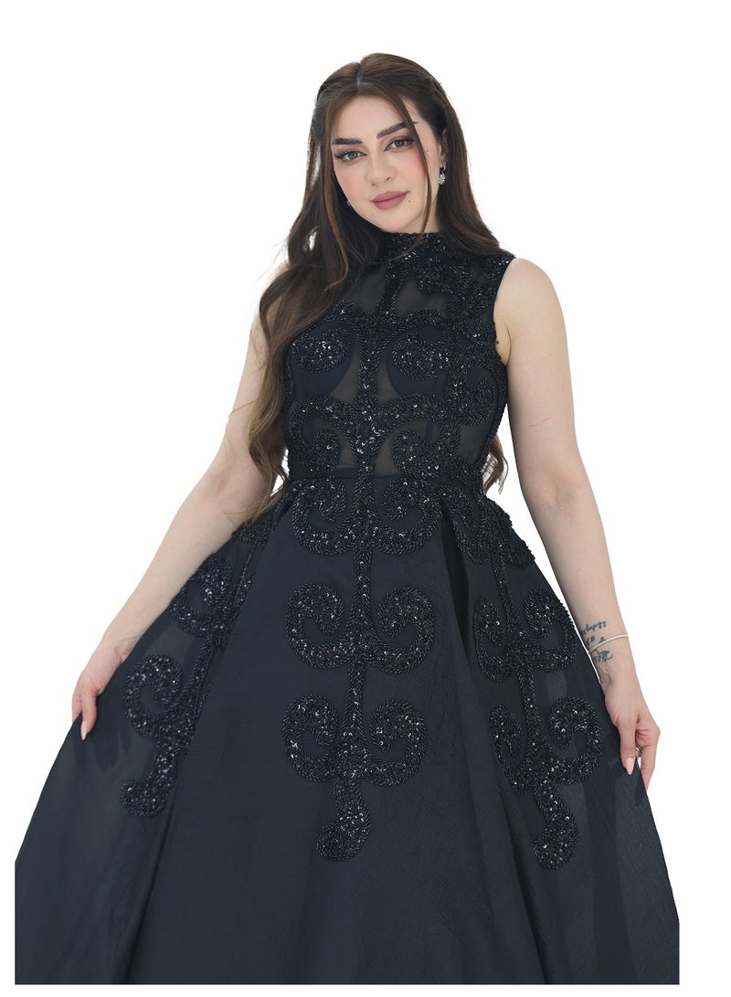 Modern Design A luxurious black evening dress made of Aqinza material. The dress is designed with a high collar and embroidery in the shape of a luxurious tree. A royal cut that highlights the beauty of the figure  - Image 3