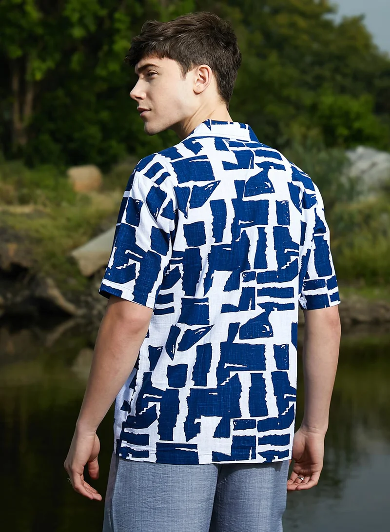Campus Sutra Campus Sutra Men's Electric Blue & Cream White Imprint Oversized Shirt For Casual Wear | Cuban Collar | Short Sleeves | Button Closure | Oversized Shirt Crafted With Comfort Fit For Everyday Wear