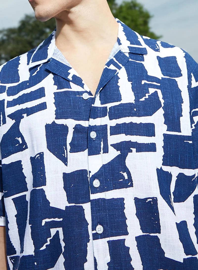 Campus Sutra Campus Sutra Men's Electric Blue & Cream White Imprint Oversized Shirt For Casual Wear | Cuban Collar | Short Sleeves | Button Closure | Oversized Shirt Crafted With Comfort Fit For Everyday Wear