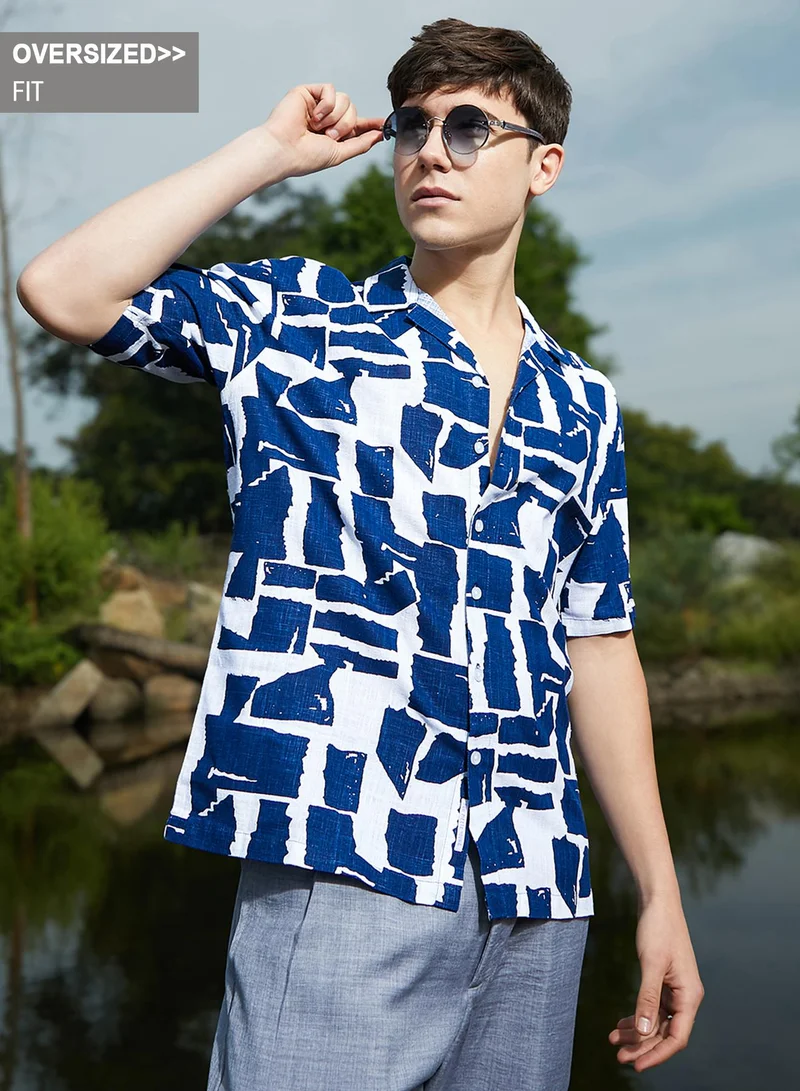 Campus Sutra Campus Sutra Men's Electric Blue & Cream White Imprint Oversized Shirt For Casual Wear | Cuban Collar | Short Sleeves | Button Closure | Oversized Shirt Crafted With Comfort Fit For Everyday Wear