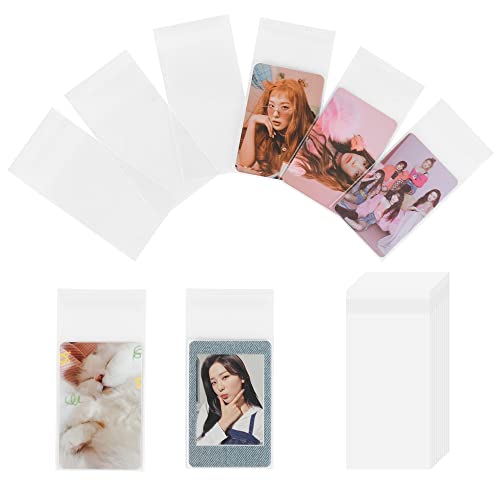 Baskiss 100 Packs Photocard Sleeves, 59 x 90 mm 200 Microns Kpop Clear Sleeves Idol Photo Cards Transparent Protector Trading Cards Shield Cover (Sealable) - Image 1