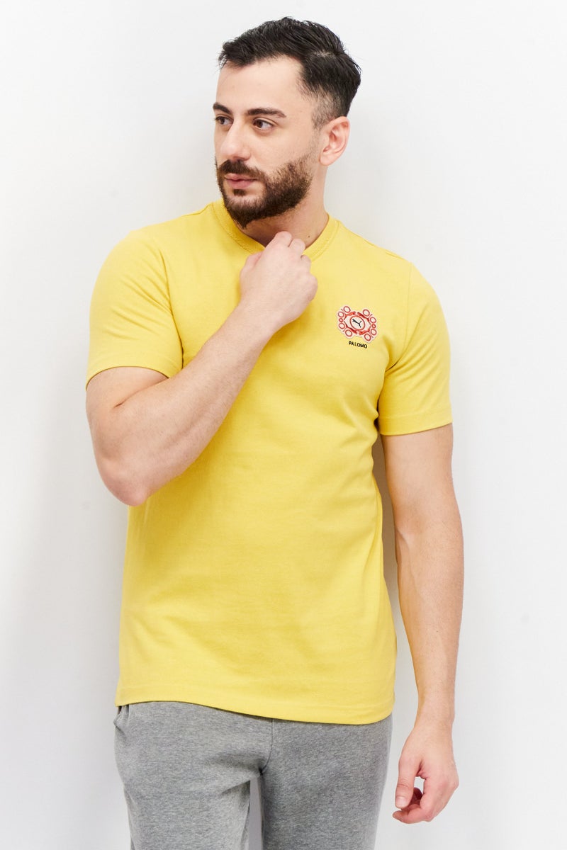 Puma x Palomo Men Sportswear Fit Short Sleeves Embroidered Logo T-Shirt, Mustard - Image 1