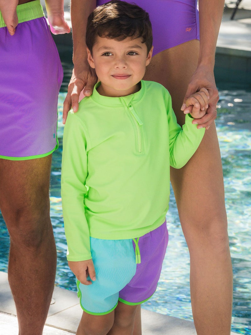 RUGGEDBUTTS Boys UPF50+ Sun Protected Stretch Dolphin Hem Swim Trunks - Neon Bright Aqua Color Block, 3-6m - Image 3