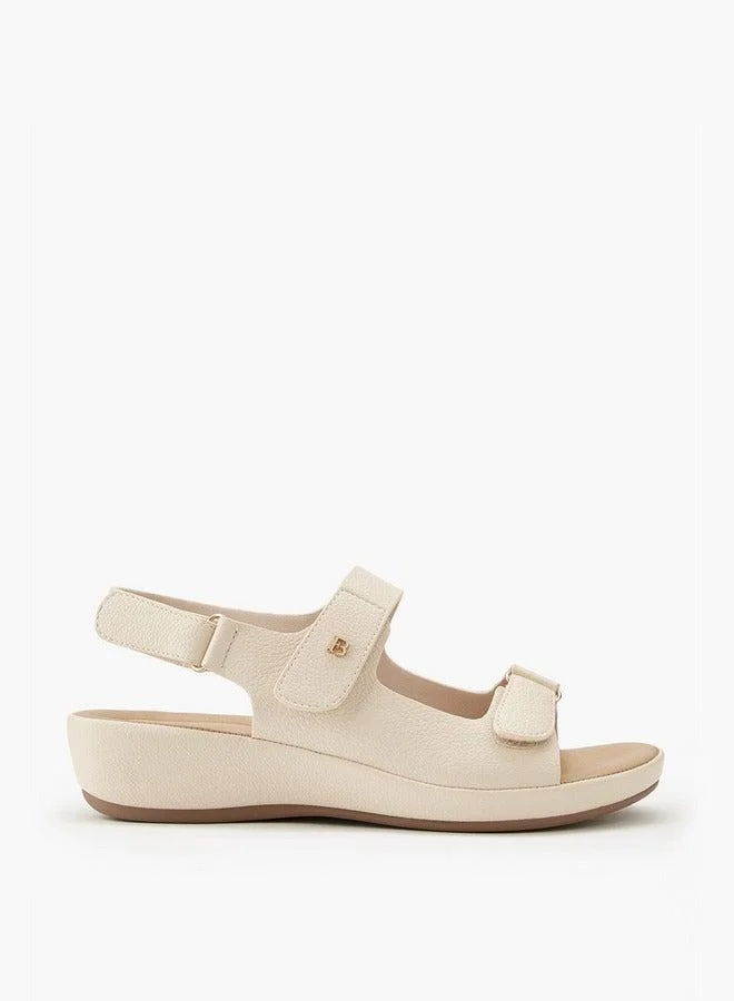 فلورا بيلا من شو إكسبرس صنادل صلبة بإغلاق بشريط لاصق