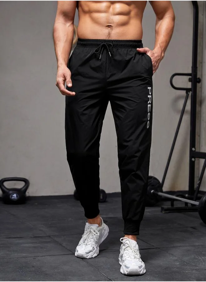 ستايلي Slogan Printed Track Pants with Drawstring by Styli
