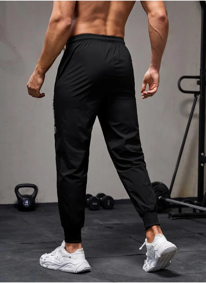 ستايلي Slogan Printed Track Pants with Drawstring by Styli