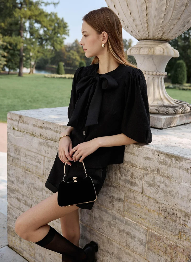 Lichi  Textured blouse with a voluminous bow for Women | Best Price UAE