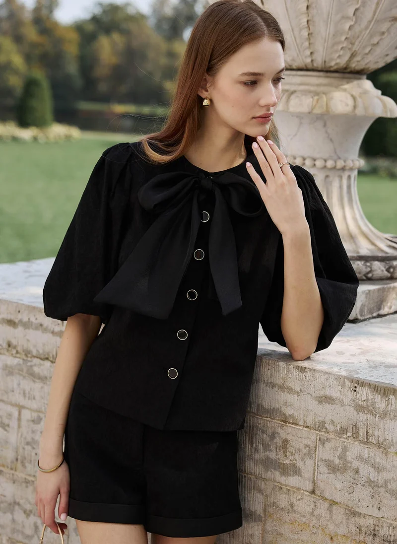 Lichi  Textured blouse with a voluminous bow for Women | Best Price UAE