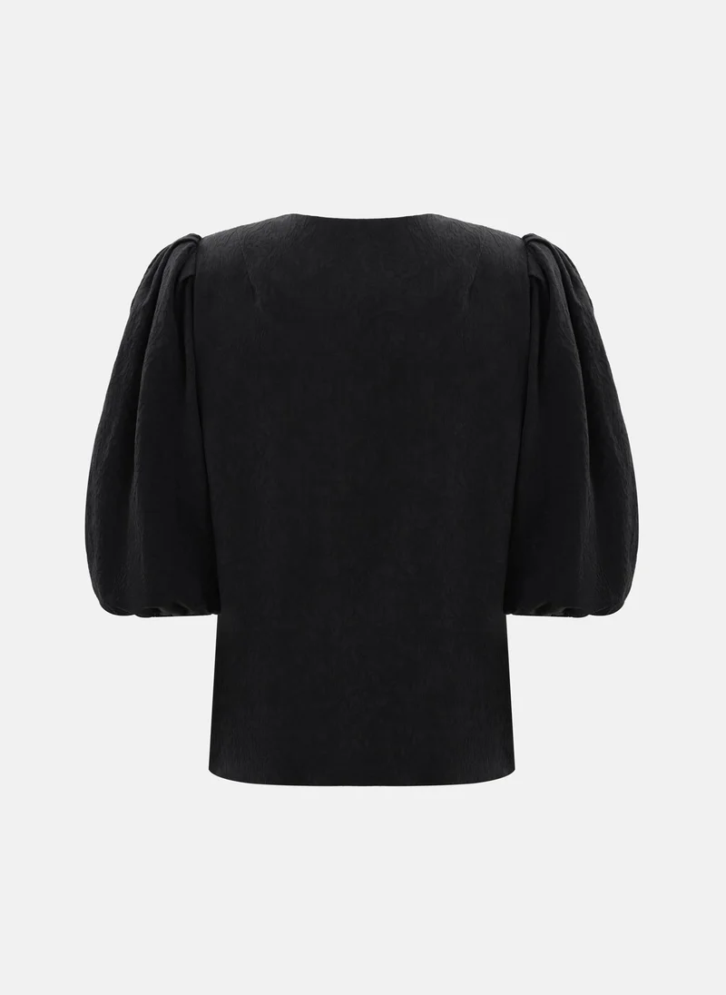 Lichi  Textured blouse with a voluminous bow for Women | Best Price UAE