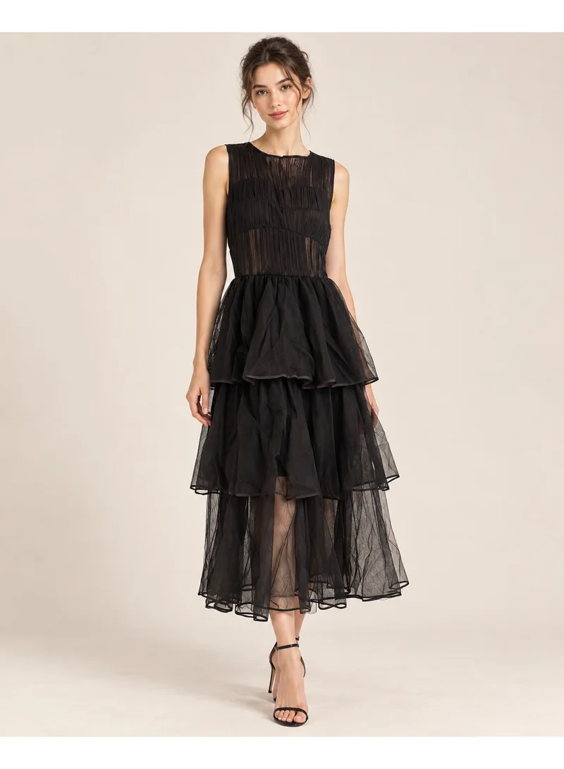 2Trendy Women's Black Midi Sleeveless Dress with Sheer Tiers and Ruched Bodice