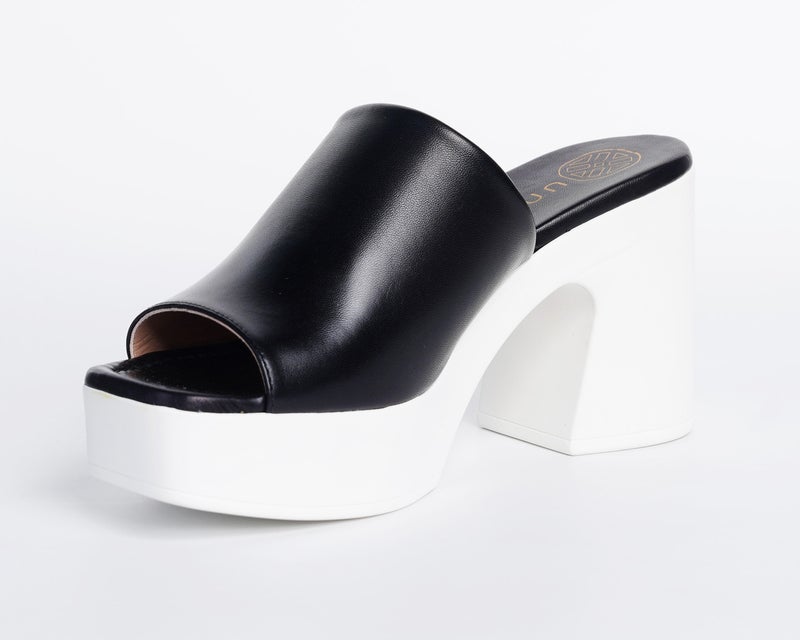 White high-heel Slip-on sandals from UNISA in white and black.