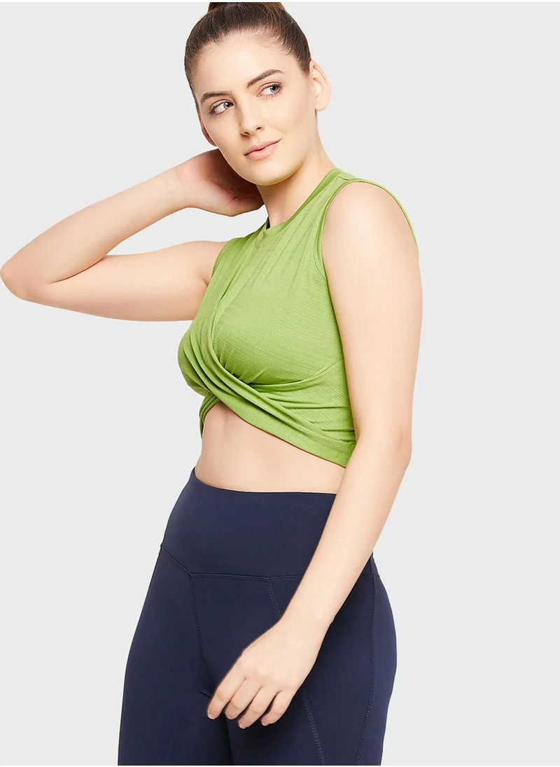 Clovia Comfort-Fit Front Knot Active Crop Top in Pista Green