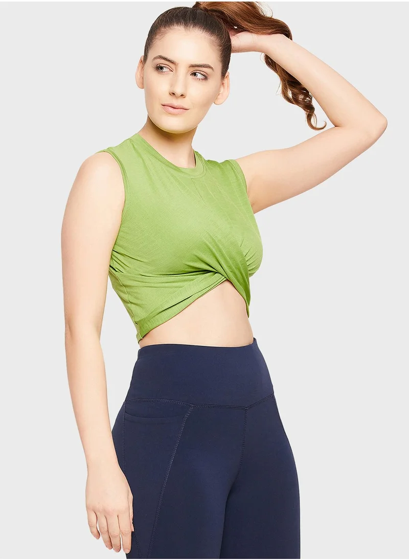 Clovia Comfort-Fit Front Knot Active Crop Top in Pista Green