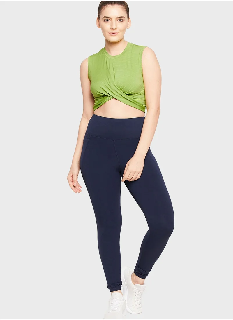 Clovia Comfort-Fit Front Knot Active Crop Top in Pista Green