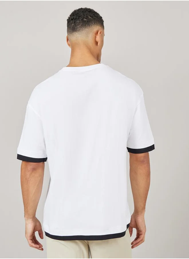 ستايلي Contrast Panel Oversized T-Shirt with Badge Detail