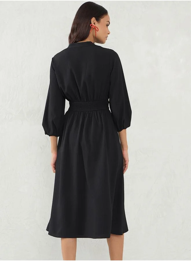 Femmella Solid Cinched Waist A-Line Midi Dress by Styli