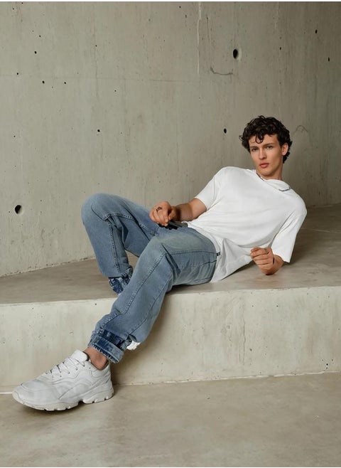 Blue Relaxed Fit Jeans Solid design crafted from 100% Cotton with Button closure.