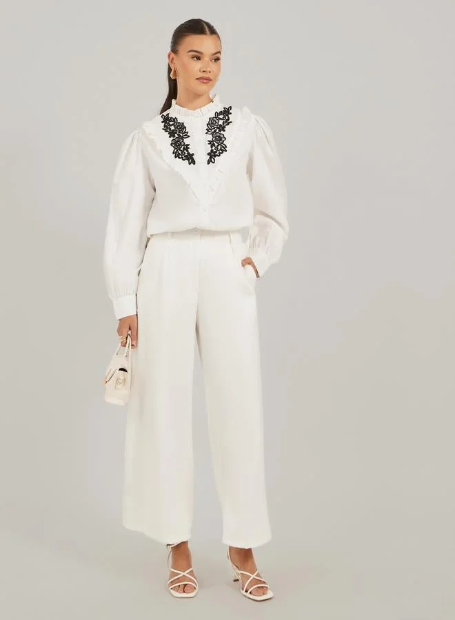 تايك تو بلوزة ستايلي بأكمام بالون مطرزة بالزهور وتفاصيل مكشكشة