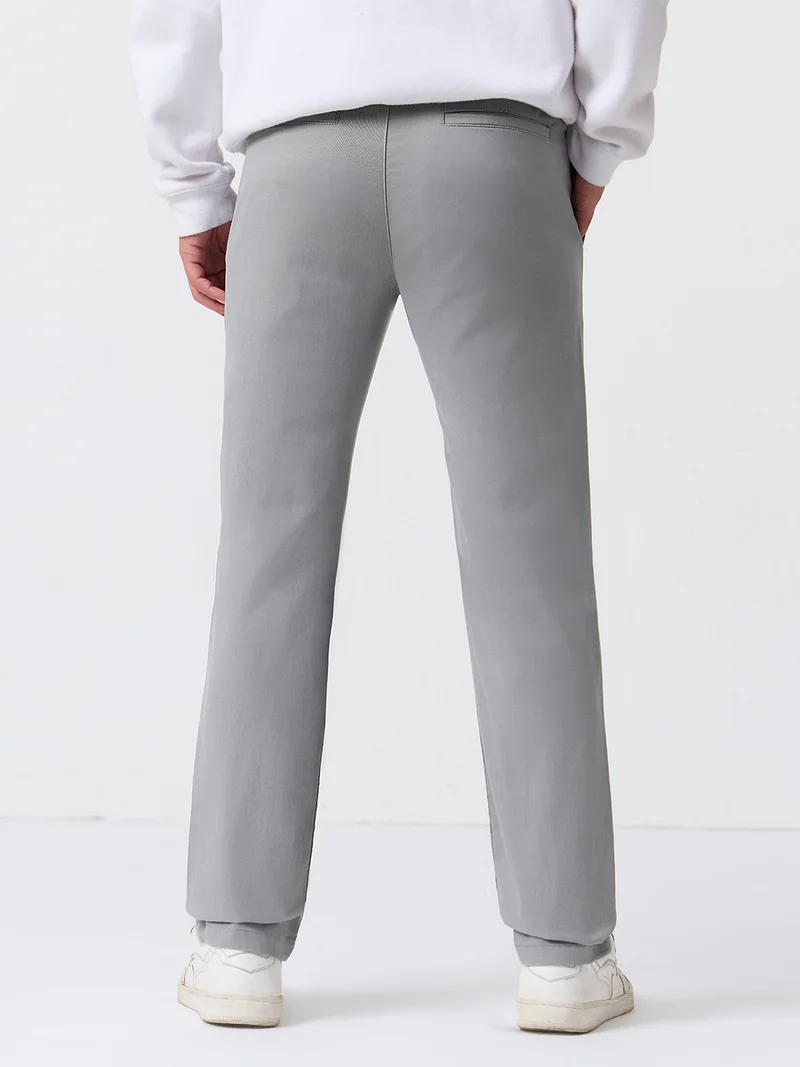 The Souled Store  The Souled Store : Chino Trousers Men And Boys Grey Solid Cotton Spandex Straight Fit Stretch Elasticated Waistband Trousers  | Best Price UAE
