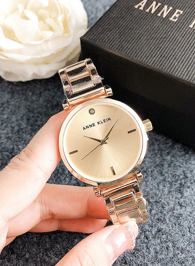Anne Klein Women's Tonneau Simplicity Gold Fashion Watch with Gold Stainless Steel Strap