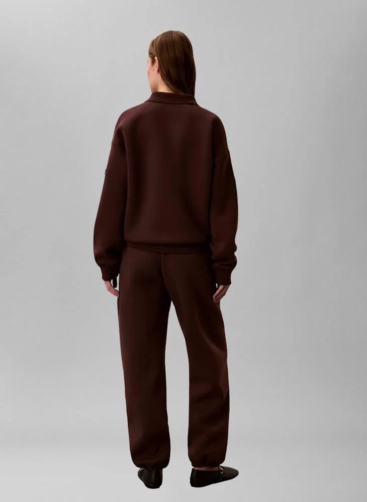 كالفن كلاين بلوزة بولو واسعة بشعار