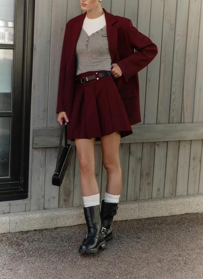Lichi Mini pleated skirt with eco-leather belt