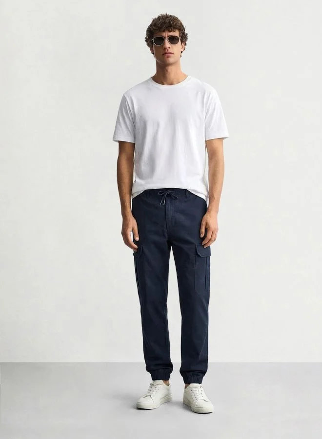 The Indian Garage Co Men Regular Fit Solid Cargo Pocket Mid-Rise Cargo Joggers