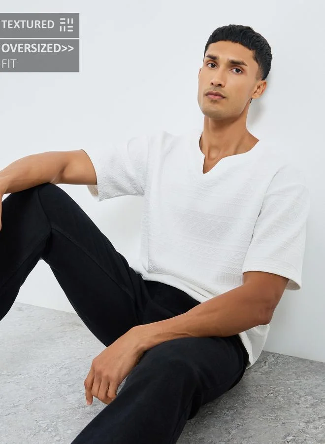 Styli White Styli White Textured Oversized Notch Neck T-Shirt for Men | Best Price UAE
