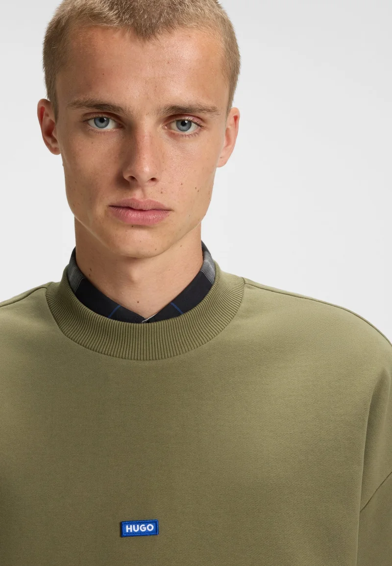 HUGO Open Green Cotton-terry sweatshirt with blue logo patch for Men | Best Price UAE