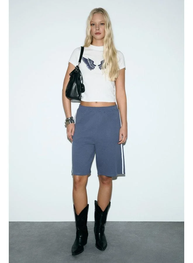 GRIMELANGE LLEONA Women's Stripe-Detail Double Pocket Organic Cotton Regular Indigo Shorts.