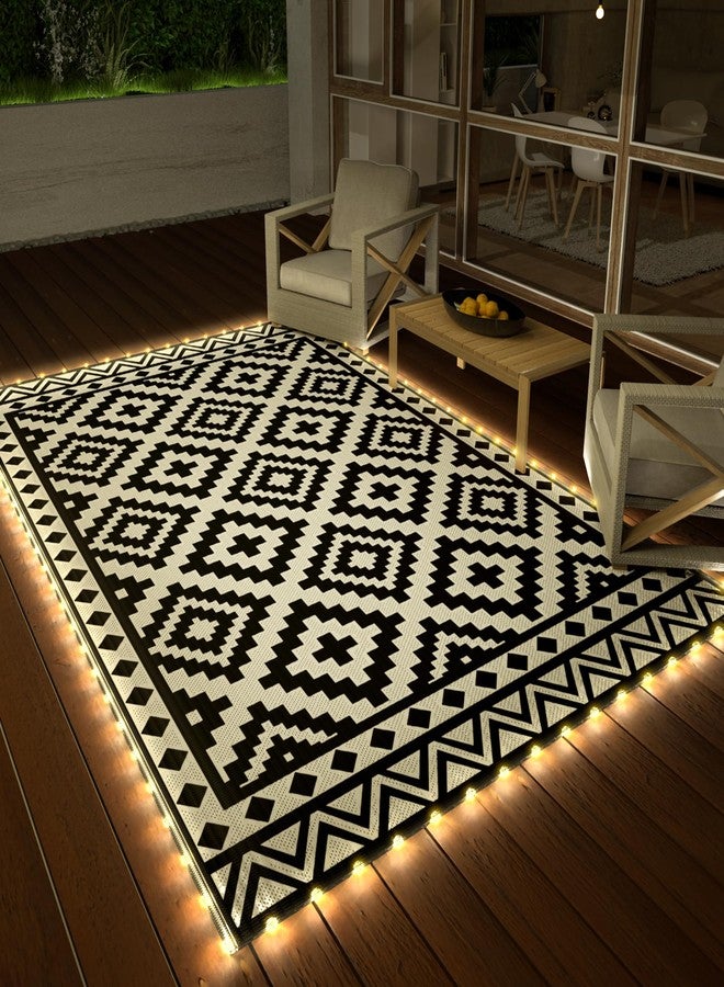 HAUSHOF 5'X8' Outdoor Rug Waterproof with LED Strip Light, Reversible Outdoor Plastic Straw Rug, Patio Rug with 4 Rug Stakes, Outdoor Carpet Mat for RV, Camping, Beach, Porch, Balcony, Black&White - Image 1