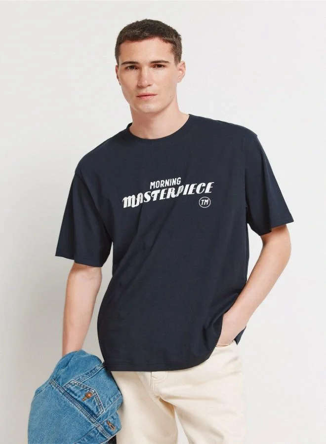 Springfield Cotton loose fit short-sleeved T-shirt with ribbed round neck, high-density chest prints and photographic back print.