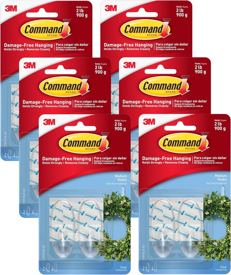 Command Medium Wall Hooks, Damage Free Hanging Wall Hooks with Adhesive Strips, No Tools Wall Hooks for Hanging Decorations in Living Spaces, 12 Clear Wall Hooks and 24 Strips - Image 1