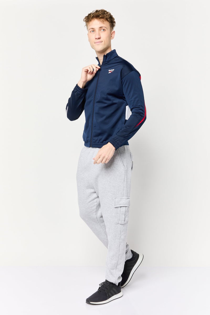 Reebok جاكيت رياضي للرجال بأكمام طويلة من نسيج فيكتور، خارجي، لون كحلي - Image 2