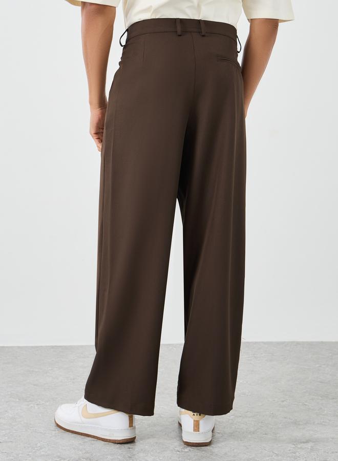 ستايلي سراويل رجالية واسعة بكسرات مزدوجة باللون البني - Image 4