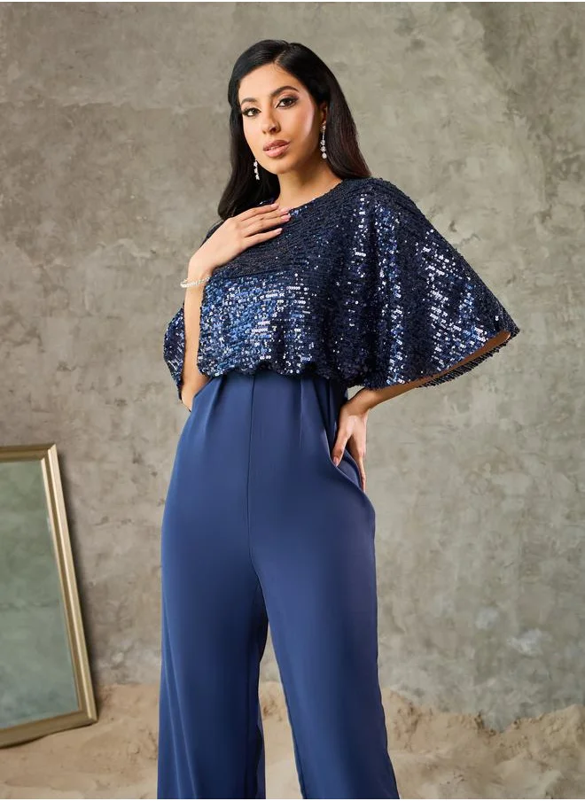 ستايلي Sequin Cape Sleeve Wide Leg Jumpsuit