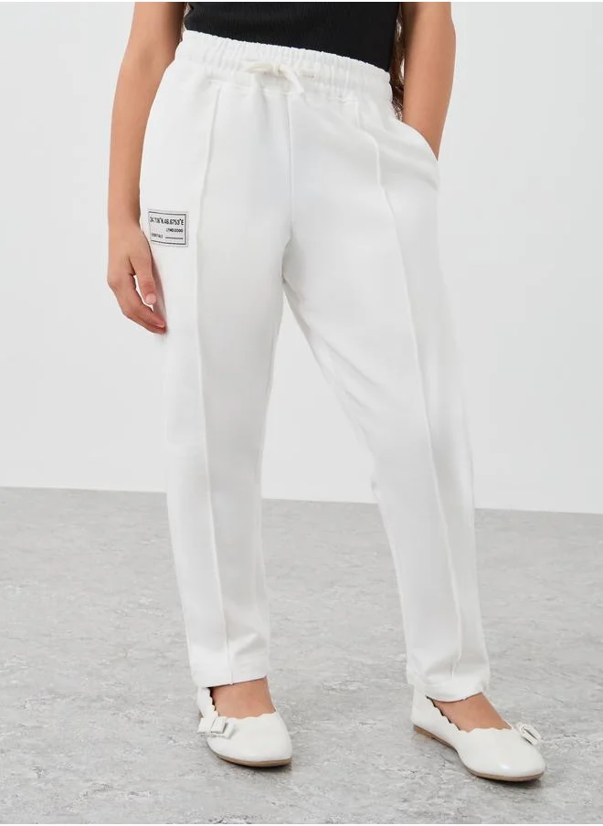 ستايلي Styli Girls Off White Solid Drawstring Waist Joggers with Front Seam