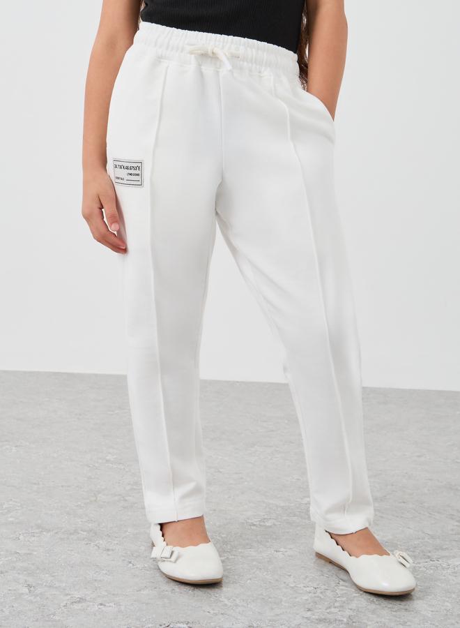 Styli Styli Girls Off White Solid Drawstring Waist Joggers with Front Seam  - Image 1
