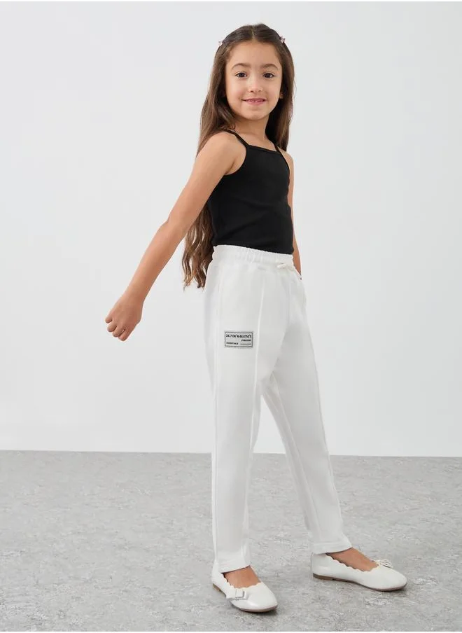 ستايلي Styli Girls Off White Solid Drawstring Waist Joggers with Front Seam