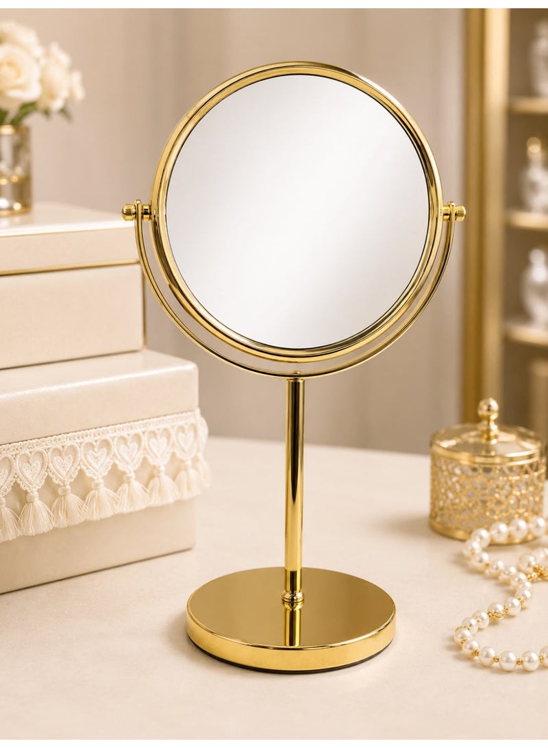 Double-sided round makeup mirror with a rotating gold metal base.