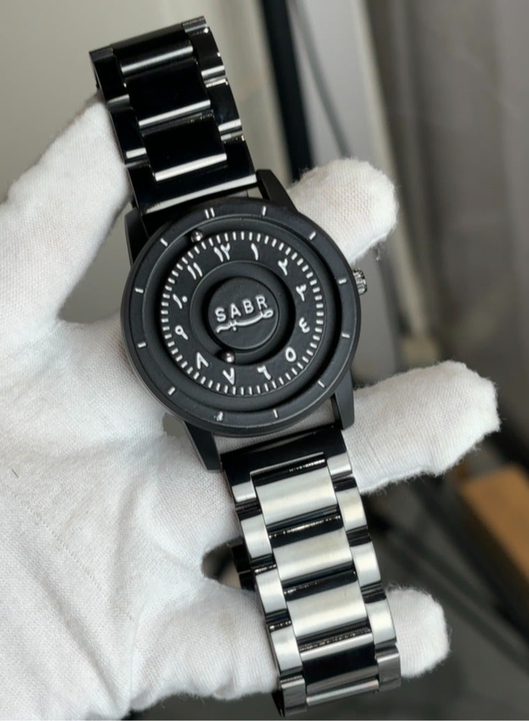 general ساعة صبر العربية، ساعة كوارتز مع قرص أرقام عربية، تصميم كرات الرفع المغناطيسي، حزام من الفولاذ المقاوم للصدأ 304 - هدية مثالية لعشاق الساعات الإسلامية - أسود - Image 2