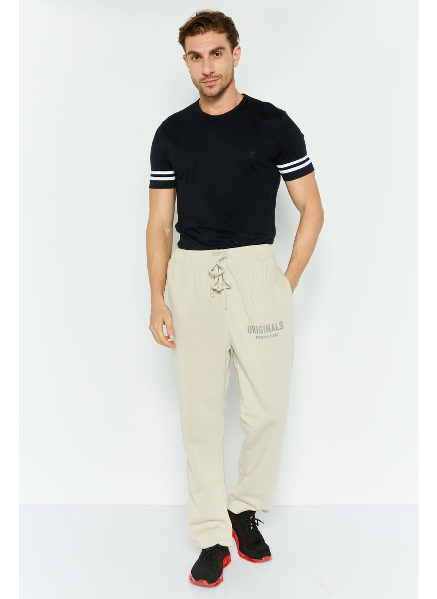 Men Relaxed Fit Drawstring Side Pocket Sweatpants, Sand - pzsku/ZBA895A84189D7D4DB79BZ/45/_/1739801746/0041a319-8a01-49e9-8ae8-1aa3ee9dd056