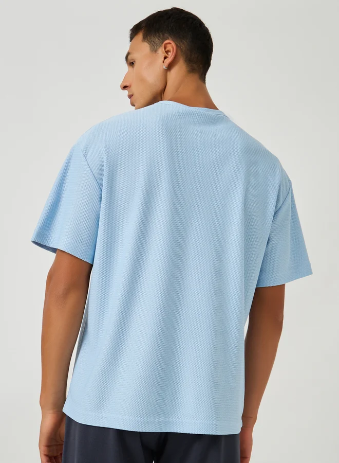 Styli Styli Men Textured Henley Neck Oversized T-Shirt
