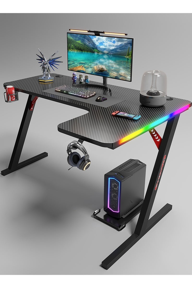 ميشيدا مكتب ألعاب على شكل حرف L بسطح من ألياف الكربون وأضواء LED RGB – طاولة كمبيوتر زاوية مقاس 160 سم مع حامل أكواب، خطاف سماعات رأس ووسادة فأرة – الجانب الأيمن، أسود - Image 1
