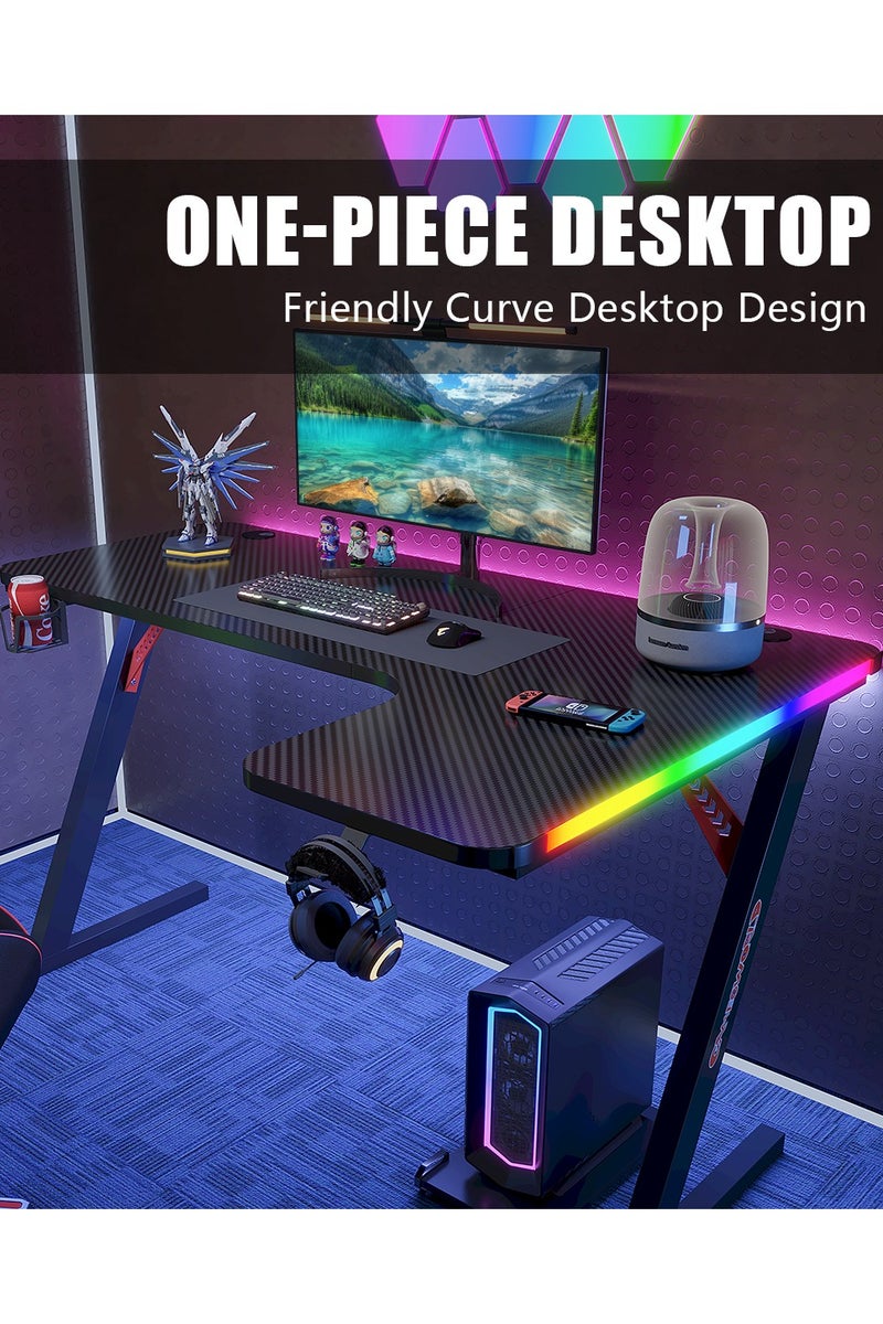 ميشيدا مكتب ألعاب على شكل حرف L بسطح من ألياف الكربون وأضواء LED RGB – طاولة كمبيوتر زاوية مقاس 160 سم مع حامل أكواب، خطاف سماعات رأس ووسادة فأرة – الجانب الأيمن، أسود - Image 2