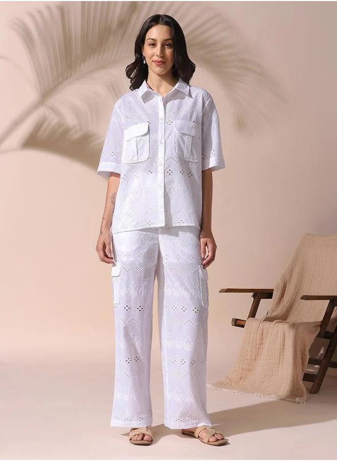 Dennis Lingo Women white relaxed fit embroidered half sleeves button down cotton blend co-ords set with button closure featuring a spread collar- your next go-to for effortless flair.