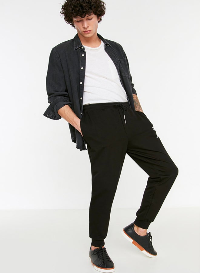 trendyol Black Regular Cut Elastic Leg Lace Up Text Printed Sweatpants TMNSS22EA0150 - Image 3