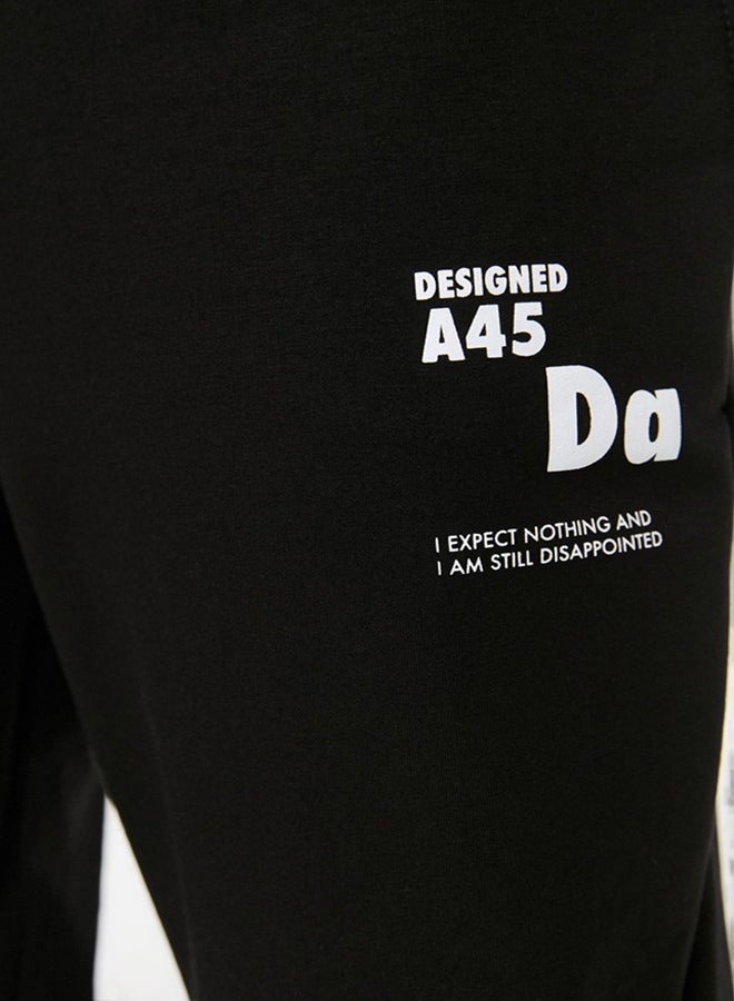trendyol Black Regular Cut Elastic Leg Lace Up Text Printed Sweatpants TMNSS22EA0150 - Image 4