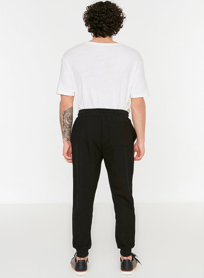 trendyol Black Regular Cut Elastic Leg Lace Up Text Printed Sweatpants TMNSS22EA0150 - Image 5